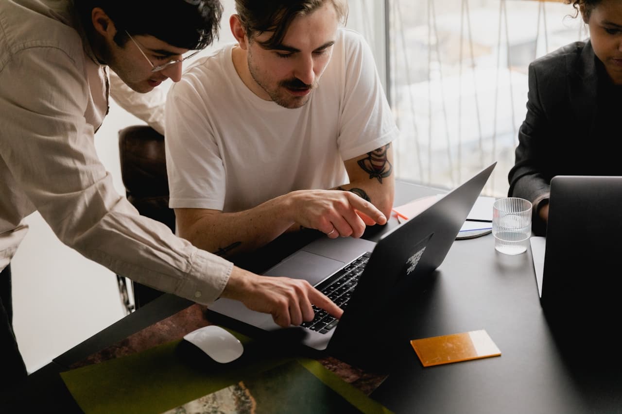 Team collaborating on AI solutions for insurance adjusting